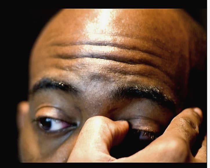 Person touching an itchy, irritated eye
